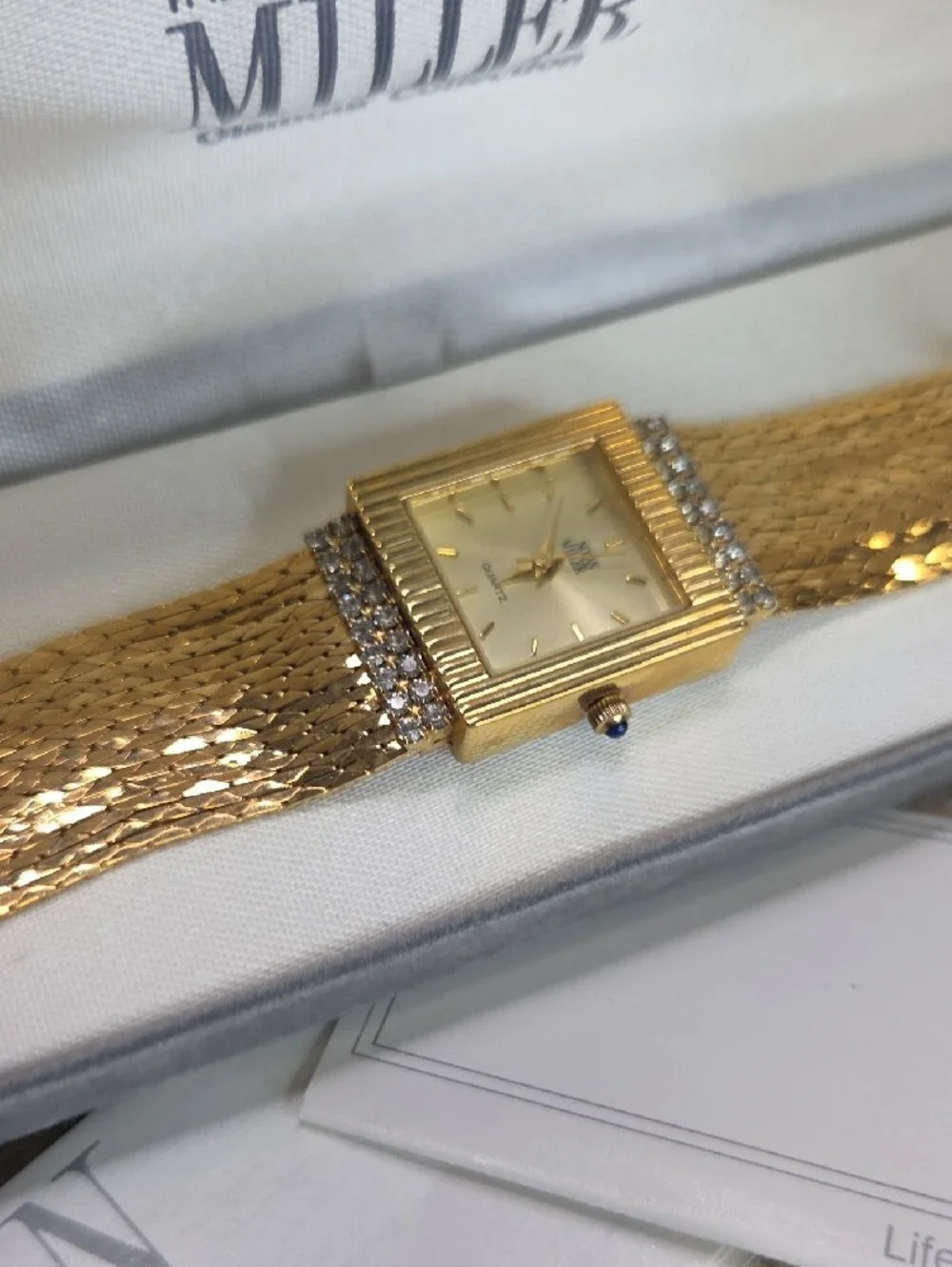 Nolan Miller Gold Chain Bracelet Watch  Rhinestone Accents Blue Sapphire Crown